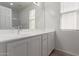 Bathroom vanity features bright lighting, framed mirror, and plenty of storage at 1857 W 22Nd Ave, Apache Junction, AZ 85120