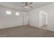 Bedroom featuring neutral carpet, ceiling fan, and a closet at 1857 W 22Nd Ave, Apache Junction, AZ 85120