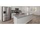 Close-up of the stainless appliances and an island in a bright, open-concept kitchen at 1857 W 22Nd Ave, Apache Junction, AZ 85120