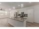 Bright open-concept kitchen featuring stainless appliances, an island, and designer backsplash at 1857 W 22Nd Ave, Apache Junction, AZ 85120