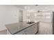 Open-concept kitchen featuring stainless appliances, an island, and view to the backyard at 1857 W 22Nd Ave, Apache Junction, AZ 85120