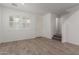 Bright living room featuring wood-look tile floors and a large window at 1857 W 22Nd Ave, Apache Junction, AZ 85120