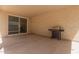 Covered patio with a sliding glass door offers an ideal outdoor space for relaxing at 1857 W 22Nd Ave, Apache Junction, AZ 85120