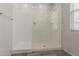 Modern bathroom showcasing a glass-enclosed shower with sleek fixtures and ample natural light at 1857 W 22Nd Ave, Apache Junction, AZ 85120