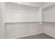 Walk-in closet featuring ample shelving and rods for closet organization at 1857 W 22Nd Ave, Apache Junction, AZ 85120
