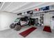 Organized garage featuring overhead storage racks and an off-road vehicle at 20556 W Point Ridge Rd, Buckeye, AZ 85396