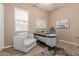 This office features a modern desk, neutral walls, a large window, and a stylish area rug at 20556 W Point Ridge Rd, Buckeye, AZ 85396