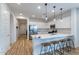 Spacious kitchen with a large island, stainless steel appliances, and sleek pendant lighting at 21303 E Estrella Rd, Queen Creek, AZ 85142
