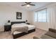 Spacious main bedroom with a large window and plush carpet at 21303 E Estrella Rd, Queen Creek, AZ 85142