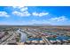 Sweeping aerial view of a Primary-planned community with water features and mountain views at 22206 N Daniel Dr, Maricopa, AZ 85138