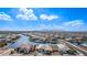 Aerial view of a lakefront community with picturesque waterfront homes, serene water views, and mountain views at 22206 N Daniel Dr, Maricopa, AZ 85138