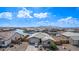A well-kept single Gathering house with a neat yard and a lake, located in a well-maintained community at 22206 N Daniel Dr, Maricopa, AZ 85138