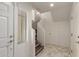 Bright entryway features marble tile flooring, white walls, stairs and a front door with sidelight at 2315 N 52Nd St # 144, Phoenix, AZ 85008
