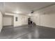 Spacious garage with painted walls, ample lighting, and a gray epoxy floor at 2315 N 52Nd St # 144, Phoenix, AZ 85008