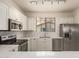 Modern kitchen with stainless steel appliances, quartz countertops, white cabinets and subway tile backsplash at 2315 N 52Nd St # 144, Phoenix, AZ 85008
