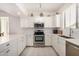 Modern kitchen boasting stainless steel appliances, white cabinets, subway tile backsplash, and quartz countertops at 2315 N 52Nd St # 144, Phoenix, AZ 85008