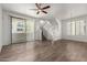 Bright, airy living room features wood floors, ceiling fan, and sliding doors to a balcony at 2315 N 52Nd St # 144, Phoenix, AZ 85008