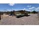 View of the home exterior with a carport area featuring a classic car at 2414 W Cholla St, Phoenix, AZ 85029