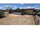 Cozy backyard featuring a brick patio, mature trees, and a screened in porch at 2414 W Cholla St, Phoenix, AZ 85029
