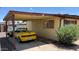 Attached carport with a yellow convertible parked alongside the house at 2414 W Cholla St, Phoenix, AZ 85029