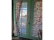 A back door with butterfly curtains at 2414 W Cholla St, Phoenix, AZ 85029