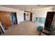 Spacious living room featuring tiled floor, brick walls, and ample natural light at 2414 W Cholla St, Phoenix, AZ 85029