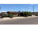 Street view of home with solar panels on the roof, well-maintained landscaping, and a carport at 2414 W Cholla St, Phoenix, AZ 85029