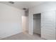 Bright bedroom with a neutral color palette, carpet flooring, closet with a 6 panel door, and ample natural light at 25096 N 154Th Ln, Surprise, AZ 85387