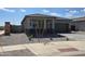 Beautiful one-story home featuring a stone-accented facade, well-maintained landscaping, and an attached garage at 25096 N 154Th Ln, Surprise, AZ 85387