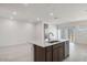 Modern kitchen with an island, stainless steel appliances, and ample counter space, perfect for cooking and entertaining at 25096 N 154Th Ln, Surprise, AZ 85387
