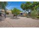 Backyard showcases lush landscaping, mature trees, and covered patio at 2510 W Columbine Dr, Phoenix, AZ 85029