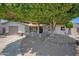 Inviting single-story home boasting mature trees, low maintenance rock landscaping, and an attached garage at 2510 W Columbine Dr, Phoenix, AZ 85029