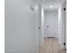 Bright hallway with white walls, recessed lighting, and neutral-toned flooring leading to multiple rooms at 2510 W Columbine Dr, Phoenix, AZ 85029