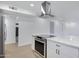 Bright kitchen featuring stainless appliances, white cabinetry, a large island, and quartz countertops at 2510 W Columbine Dr, Phoenix, AZ 85029