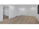 Clean and bright living room with recessed lighting and luxury vinyl plank flooring at 2510 W Columbine Dr, Phoenix, AZ 85029