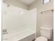 Bathroom showcasing a bathtub-shower, toilet, and chrome fixtures at 2650 W Union Hills Dr # 16, Phoenix, AZ 85027