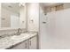 Bathroom with a white sink with a granite counter, shower, and modern fixtures at 2650 W Union Hills Dr # 16, Phoenix, AZ 85027