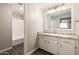 Bathroom featuring a shower-tub combo, sink with a granite counter, large mirror and modern fixtures at 2650 W Union Hills Dr # 16, Phoenix, AZ 85027