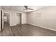 Bedroom with closet, ceiling fan, wood-look flooring, and windows overlooking the exterior at 2650 W Union Hills Dr # 16, Phoenix, AZ 85027