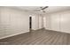 Bedroom featuring built-in storage, closet, and wood-look floors and a modern ceiling fan at 2650 W Union Hills Dr # 16, Phoenix, AZ 85027