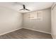 Well-lit bedroom featuring wood-look flooring, a ceiling fan, and a large window with blinds at 2650 W Union Hills Dr # 16, Phoenix, AZ 85027