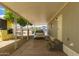 Covered carport featuring a parked car, mature citrus tree, and convenient access to the home at 2650 W Union Hills Dr # 16, Phoenix, AZ 85027