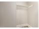 A clean, empty closet with a single shelf provides ample storage space in the home at 2650 W Union Hills Dr # 16, Phoenix, AZ 85027