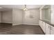 The dining room with vinyl wood floors offers ample space, cabinets and built-ins for entertaining at 2650 W Union Hills Dr # 16, Phoenix, AZ 85027