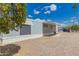 Side view of a manufactured home with a carport and a view of citrus trees at 2650 W Union Hills Dr # 16, Phoenix, AZ 85027
