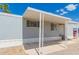 A covered front porch with white support beams provides a shady spot to relax outdoors at 2650 W Union Hills Dr # 16, Phoenix, AZ 85027