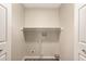 Laundry room with washer and dryer hookups and built-in shelving at 2650 W Union Hills Dr # 16, Phoenix, AZ 85027
