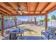 Covered patio features outdoor seating and ceiling fan overlooking a spacious, fenced backyard at 2845 E Irwin Ave, Mesa, AZ 85204
