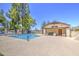 Sparkling community pool with ample seating and a covered area for relaxation and shade at 2845 E Irwin Ave, Mesa, AZ 85204
