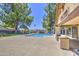 A beautiful pool with shaded seating and mature trees in a well maintained community at 2845 E Irwin Ave, Mesa, AZ 85204